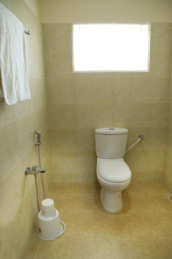 Hotel New Amirtham Inn Palni Buitenkant foto
